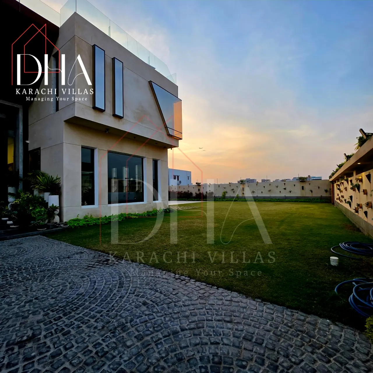 A 2000 sq yd house in DHA Phase 8, Zone B, lit up at dusk — listing KS2090